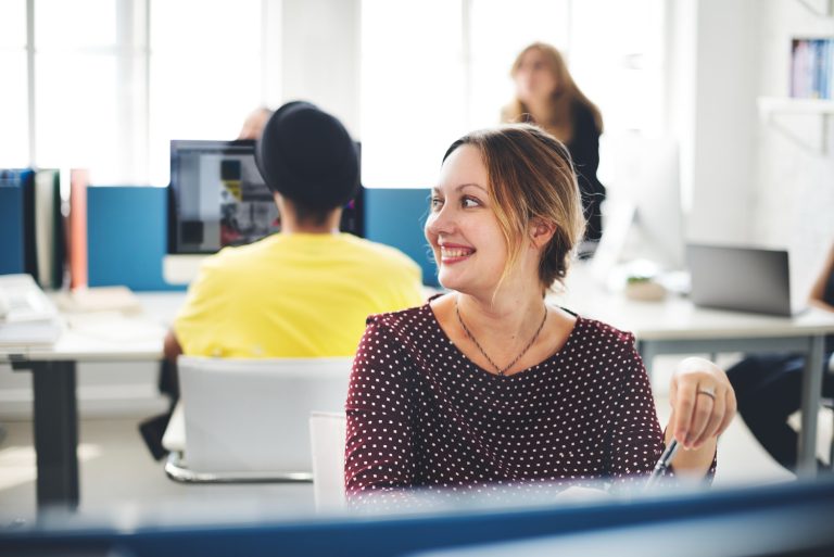 Smiling woman in coworking space