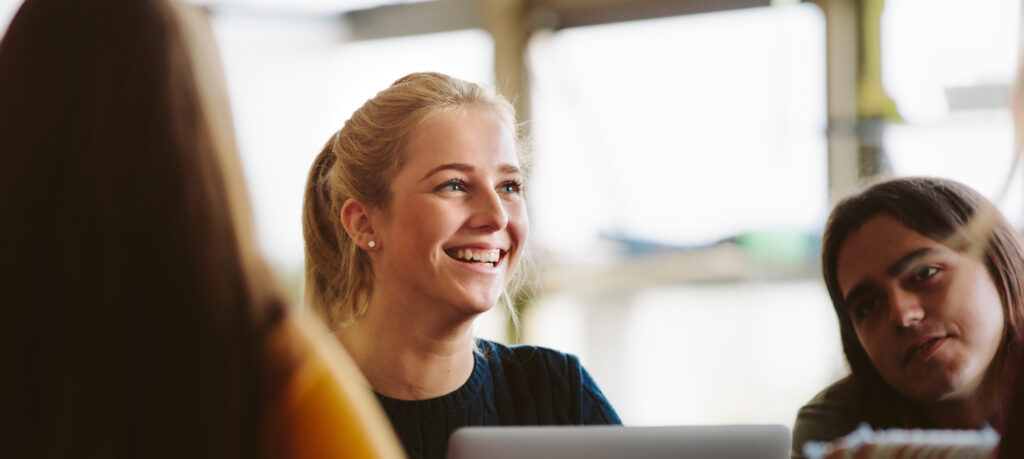 Smiling high school student at event.